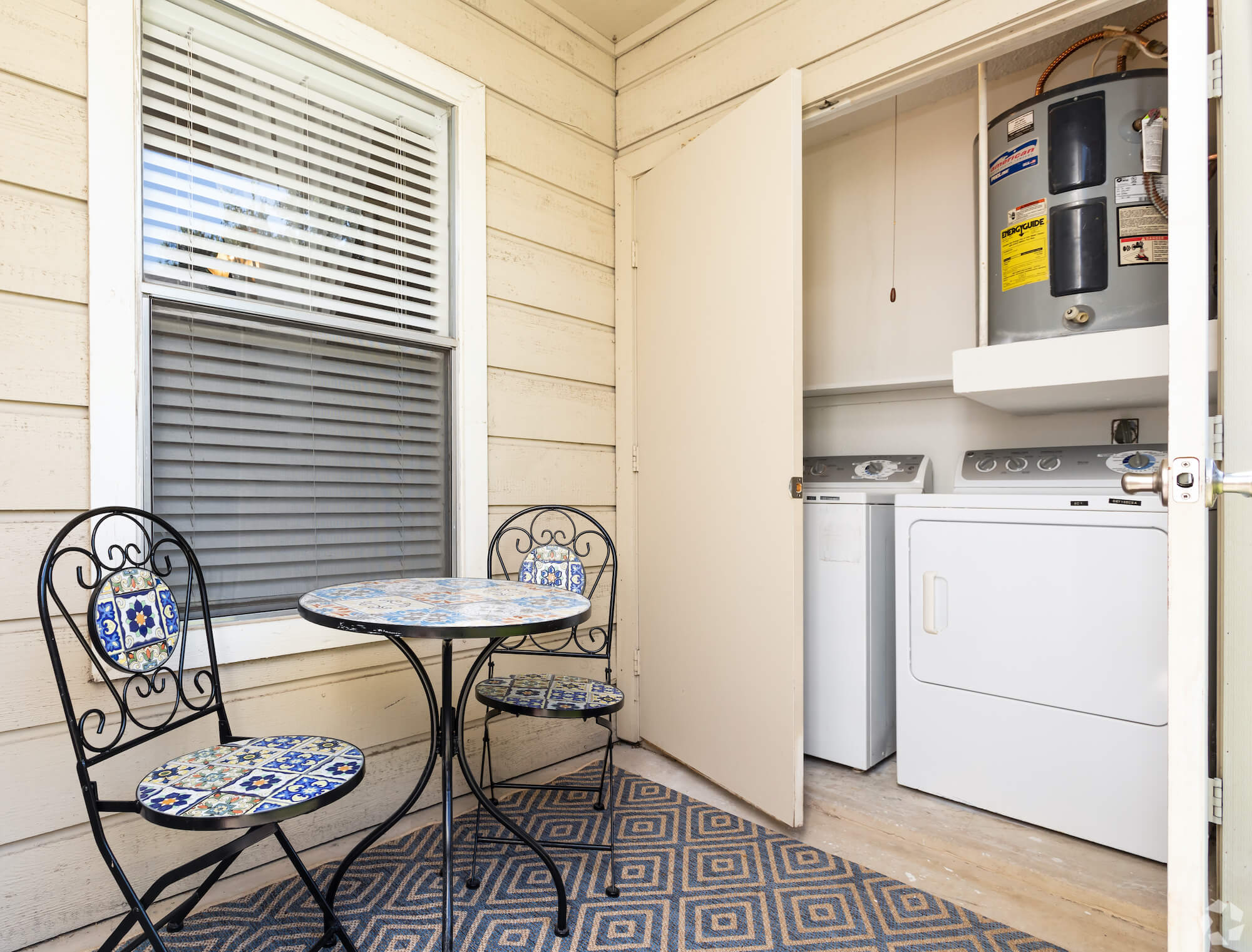 The Avalon Apartments outdoor patio with washer and dryer